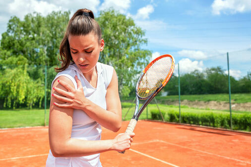 female tennis player with a injured a shoulder