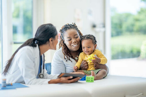 a mother with her baby at a doctor's visit 