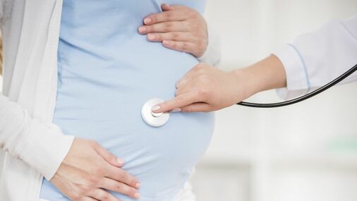 the belly of a pregnant woman 