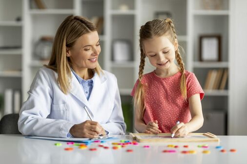 image of doctor playing a game with a child